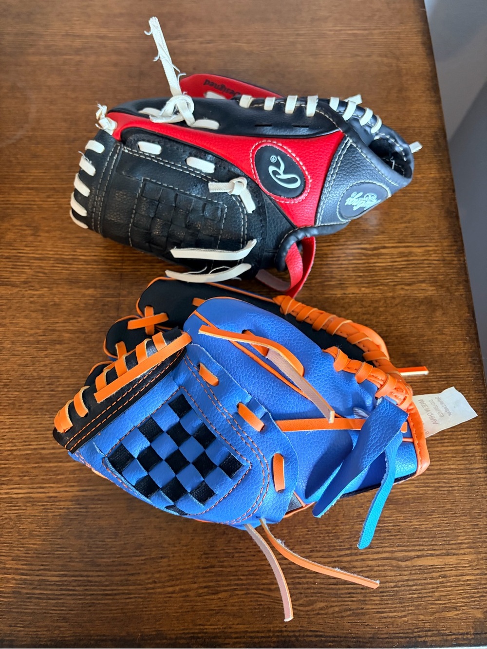 Rawlings Kids Baseball Gloves in Blue/Orange and Black/Red